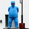 blue statue of a man on the day of his retirement