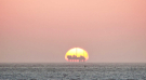sunset (revealing the Ameland gas rig)