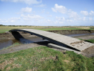 springtide on ameland - september 2022 - bridge in the salt marshes at normal tide