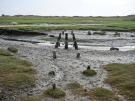 springtide on ameland - september 2022 - remains of a bridge in the salt marshes at normal tide