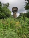 water tower near sedan