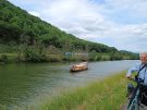 a boat, a train and a happy cyclist