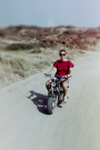 milos 1988 - trips on and around milos - rita on a very serious scooter