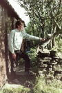 arie petting the farm cat before our cottage